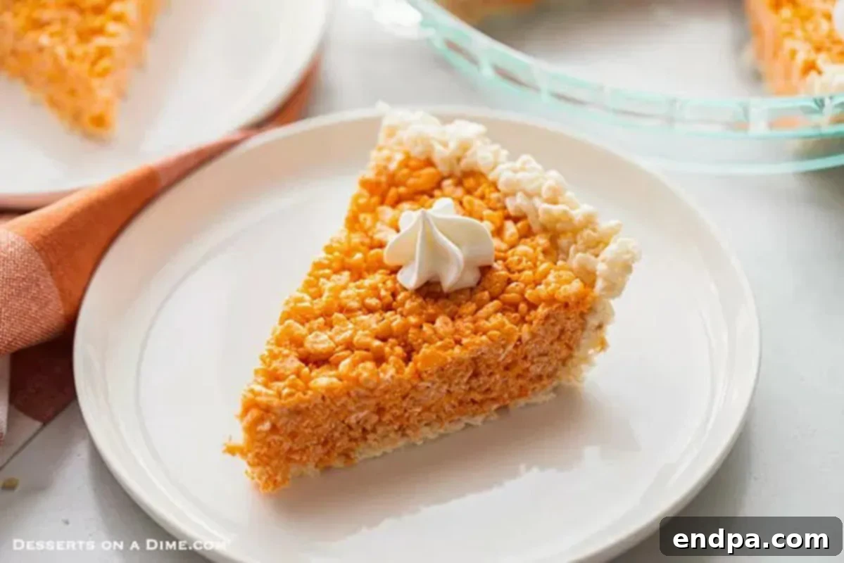 Pumpkin Pie Rice Krispie Treats on a white plate, shaped like mini pumpkin pies