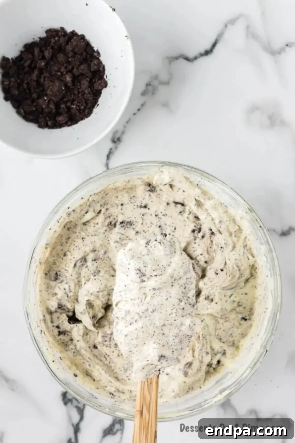 Crushed Oreo cookies folded into pudding mixture.