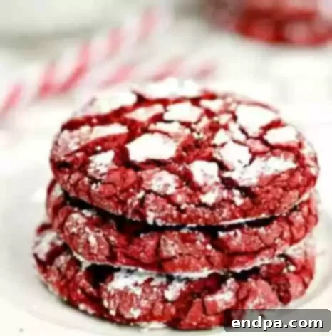 Sweet Simplicity: 60 Easy Christmas Desserts 4 Vibrant red velvet cookies with a dusting of powdered sugar.