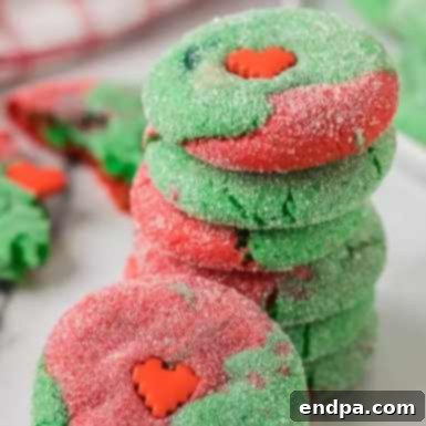 Sweet Simplicity: 60 Easy Christmas Desserts 7 Grinch cake mix cookies with festive red and green swirls.