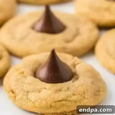 Sweet Simplicity: 60 Easy Christmas Desserts 3 Classic peanut butter kiss cookies with a chocolate Hershey's Kiss.