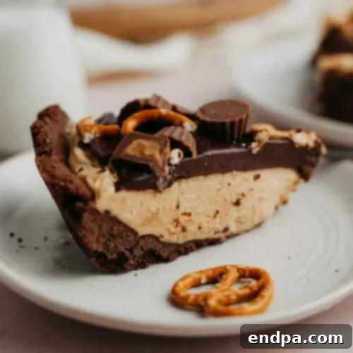 39 Must-Try Pie Recipes 6 A rich Chocolate Peanut Butter Pie with a glossy ganache topping, featuring a chocolate cookie crust and no-bake peanut butter filling.