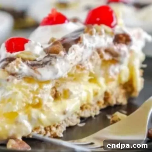 39 Must-Try Pie Recipes 9 A vibrant No-Bake Banana Split Pie, layered with bananas, pineapple, chocolate fudge, and cherries, a perfect summer treat.