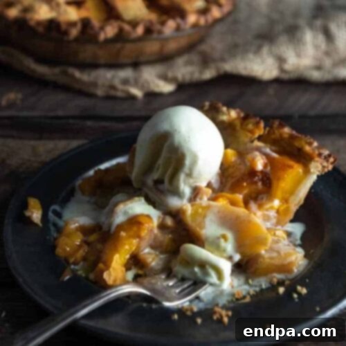 39 Must-Try Pie Recipes 14 A golden-crusted Homemade Peach Mango Pie, filled with lightly spiced fresh peaches and ripe mangoes, a delightful summer dessert.