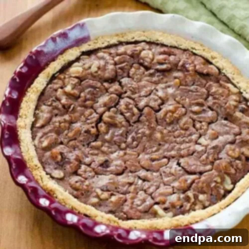 39 Must-Try Pie Recipes 17 A gooey Chocolate Walnut Pie, resembling a rich brownie baked in a pie crust, studded with crunchy walnuts, an irresistible dessert.