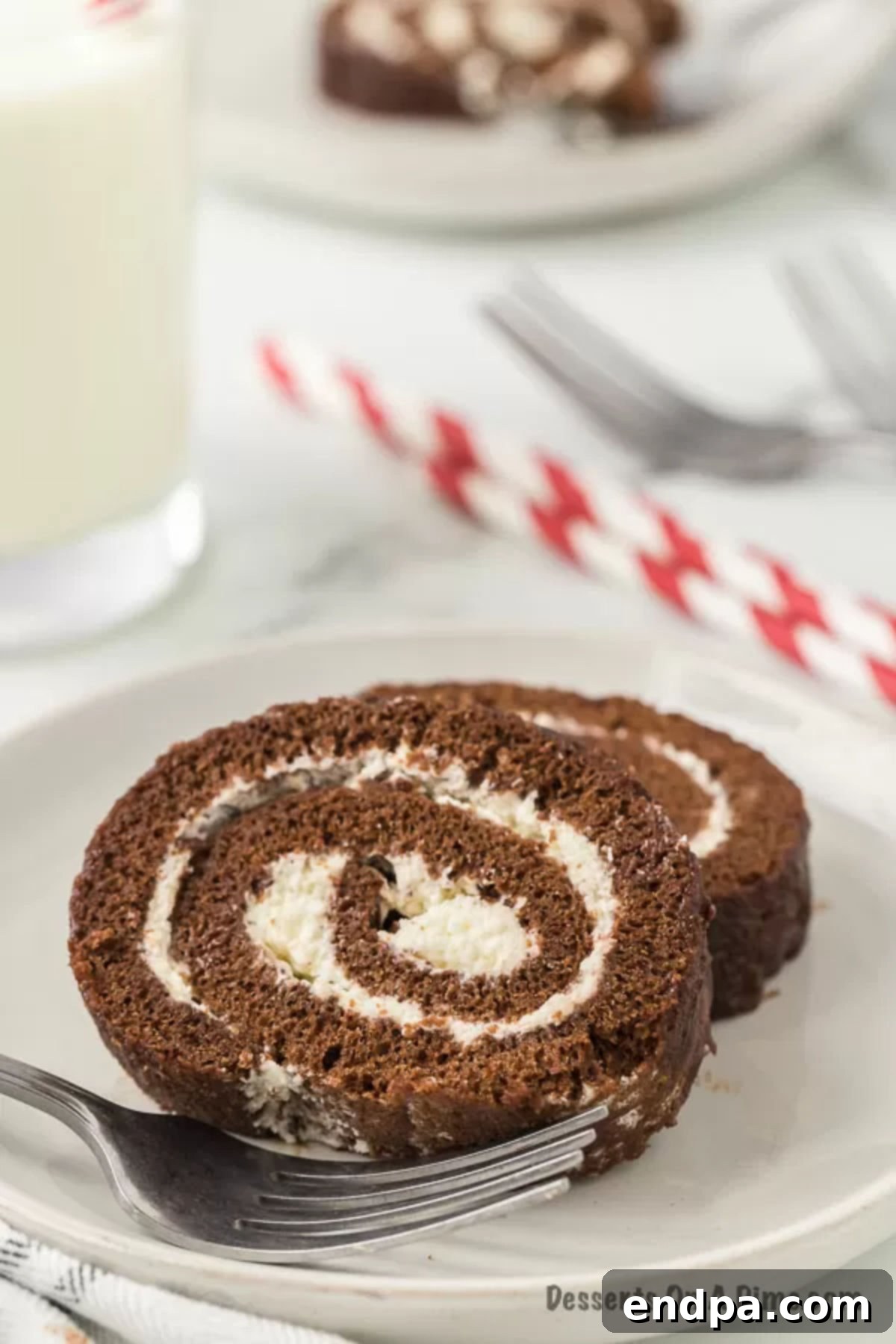 Slices of swiss roll cake on plate.