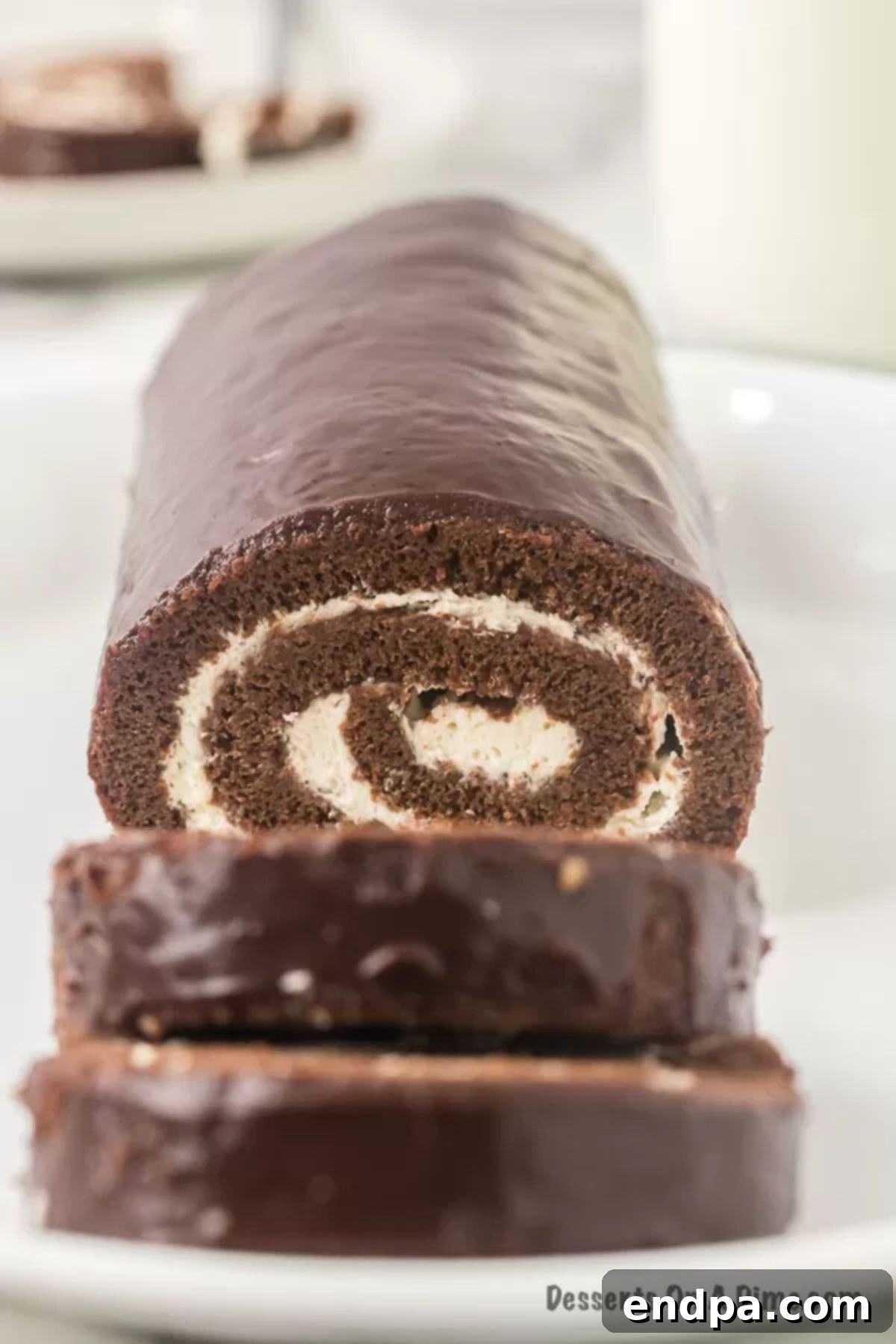 Slices of swiss roll cake on plate.