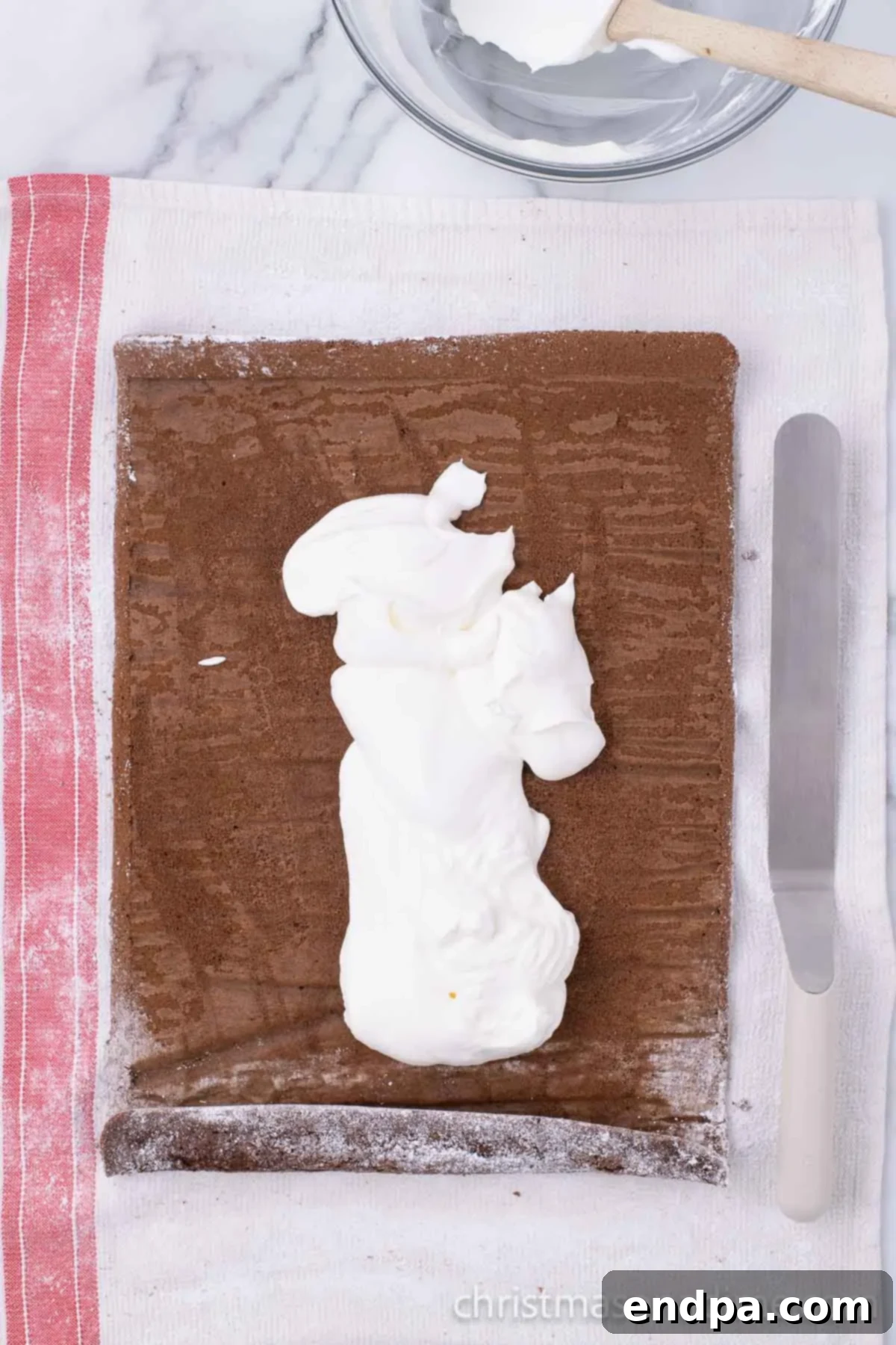 Frosting spread on cake. 