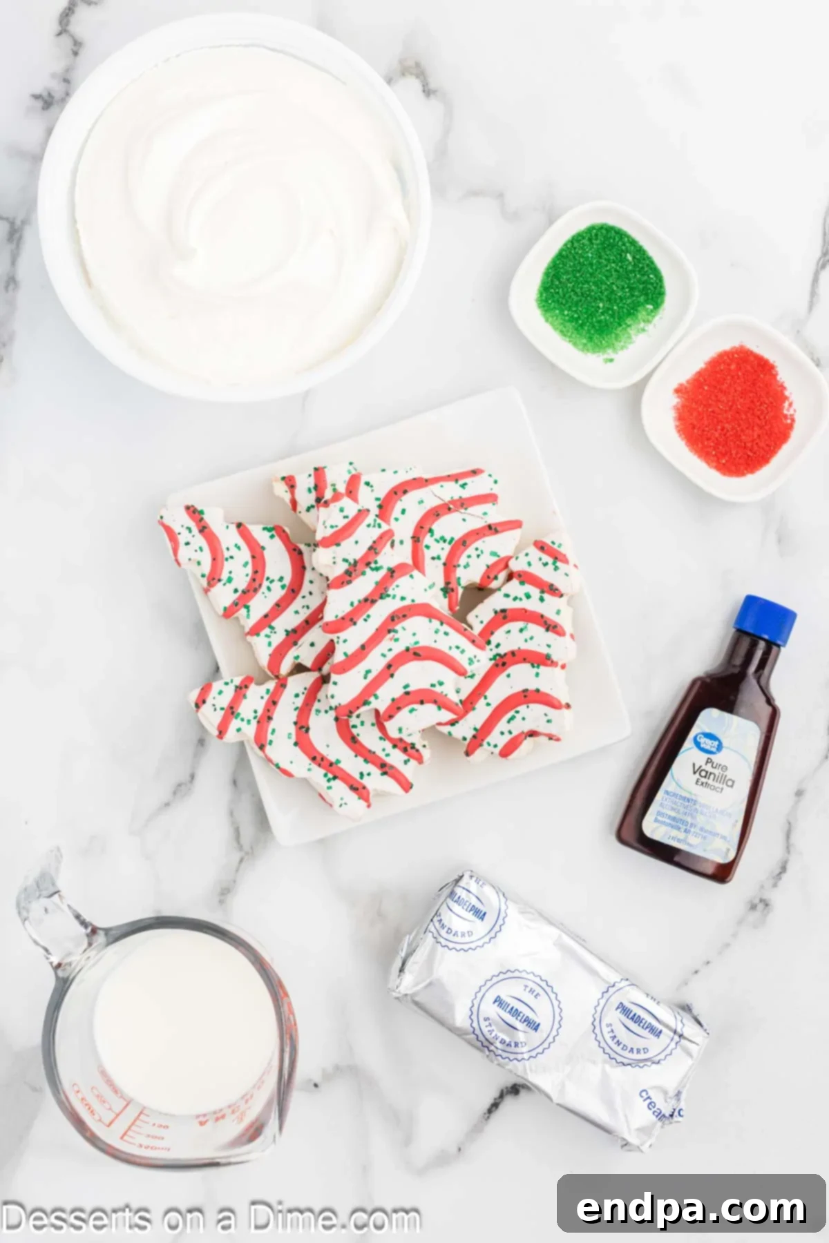 All essential ingredients for Little Debbie Christmas Tree Dip laid out: Little Debbie Christmas Tree Cakes, softened cream cheese, vanilla extract, cool whip, and festive red and green sprinkles.