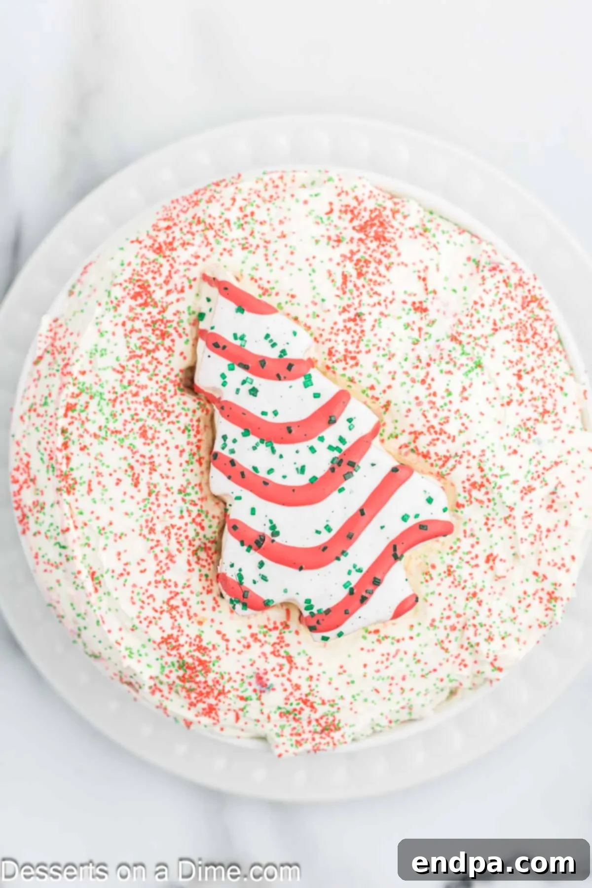 The prepared Little Debbie Christmas Tree Dip in a serving bowl, beautifully topped with colorful Christmas sprinkles and ready for guests.