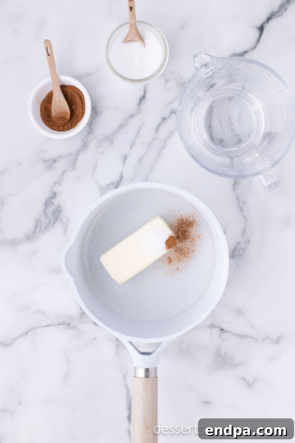 Butter, cinnamon, water in saucepan. 