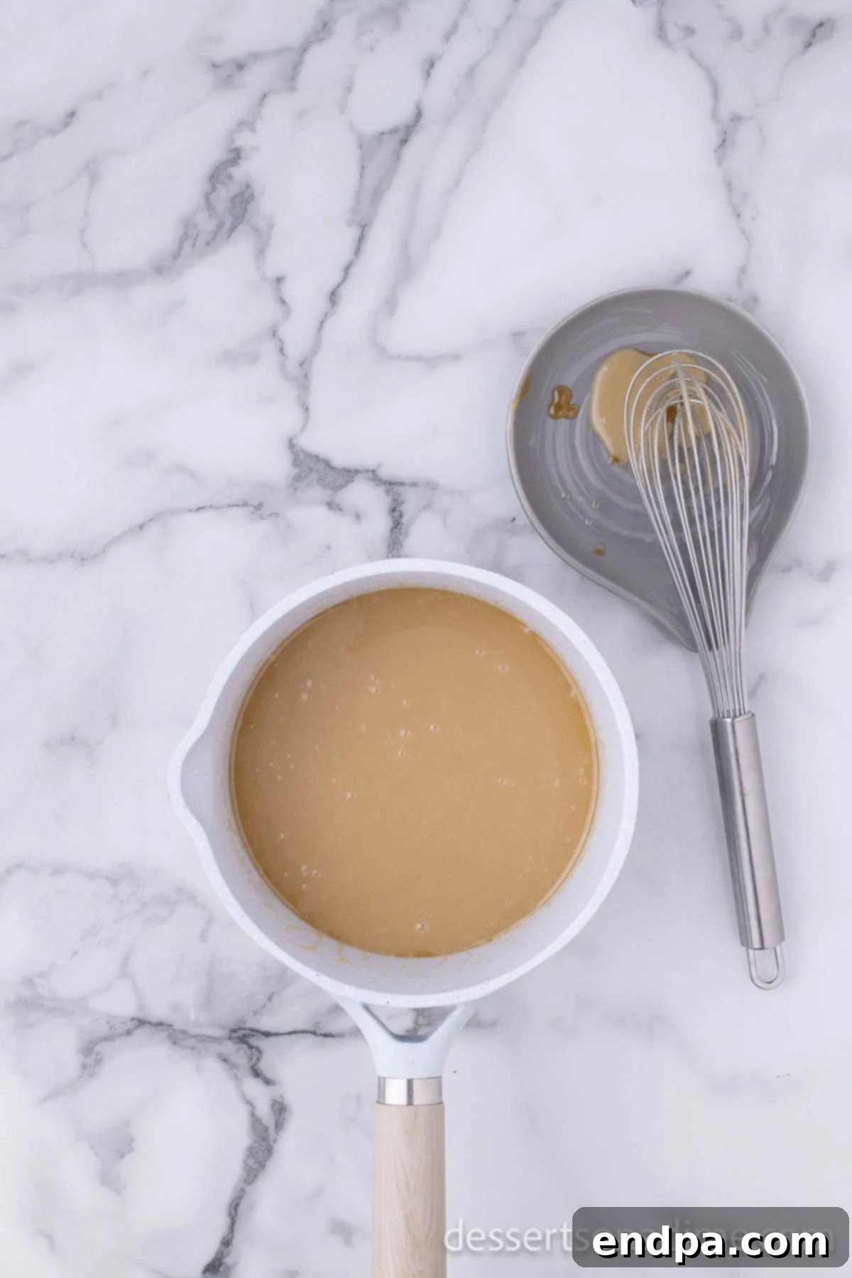 Make Your Own Twix Bars 11 Saucepan with thickened, glossy caramel mixture after cooking.