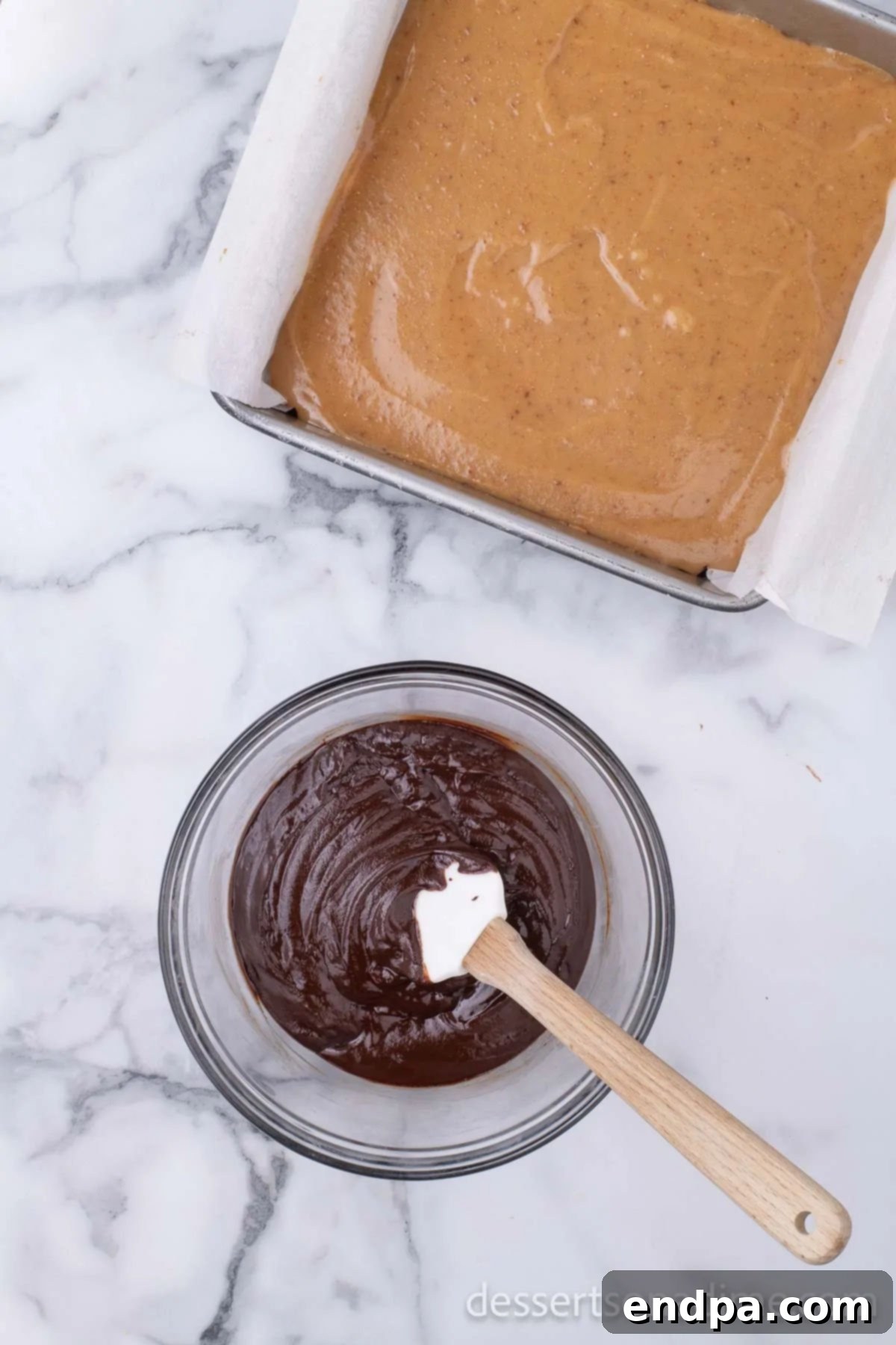 Make Your Own Twix Bars 13 Melted milk chocolate in a bowl, smooth and ready to be spread.