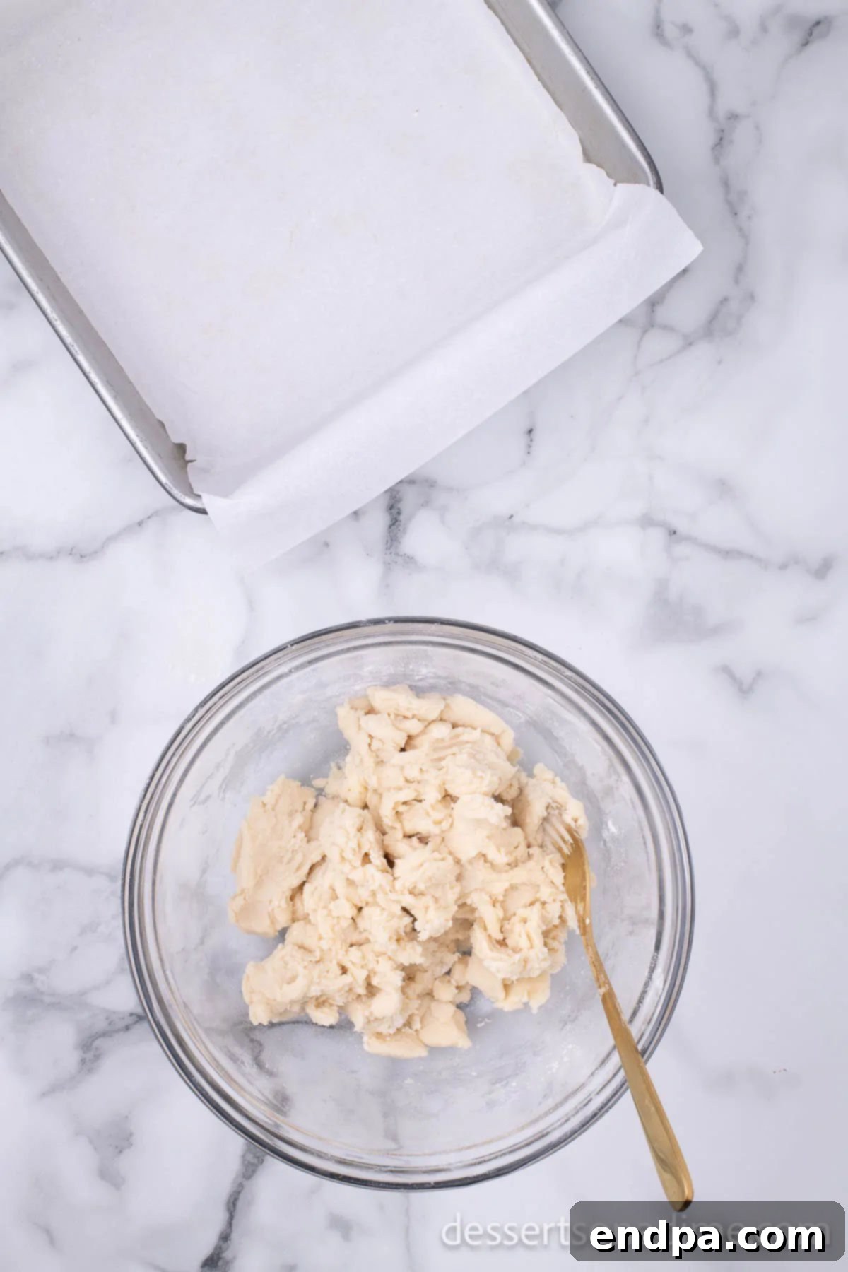 Make Your Own Twix Bars 5 Softened butter being cut into the flour and powdered sugar mixture.