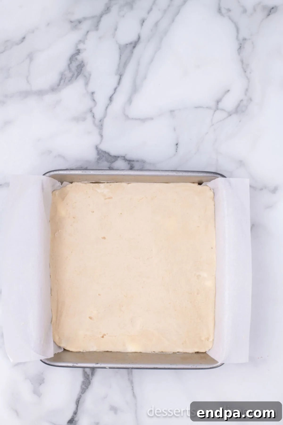 Make Your Own Twix Bars 6 The shortbread crumb mixture pressed firmly into the bottom of the prepared baking pan.