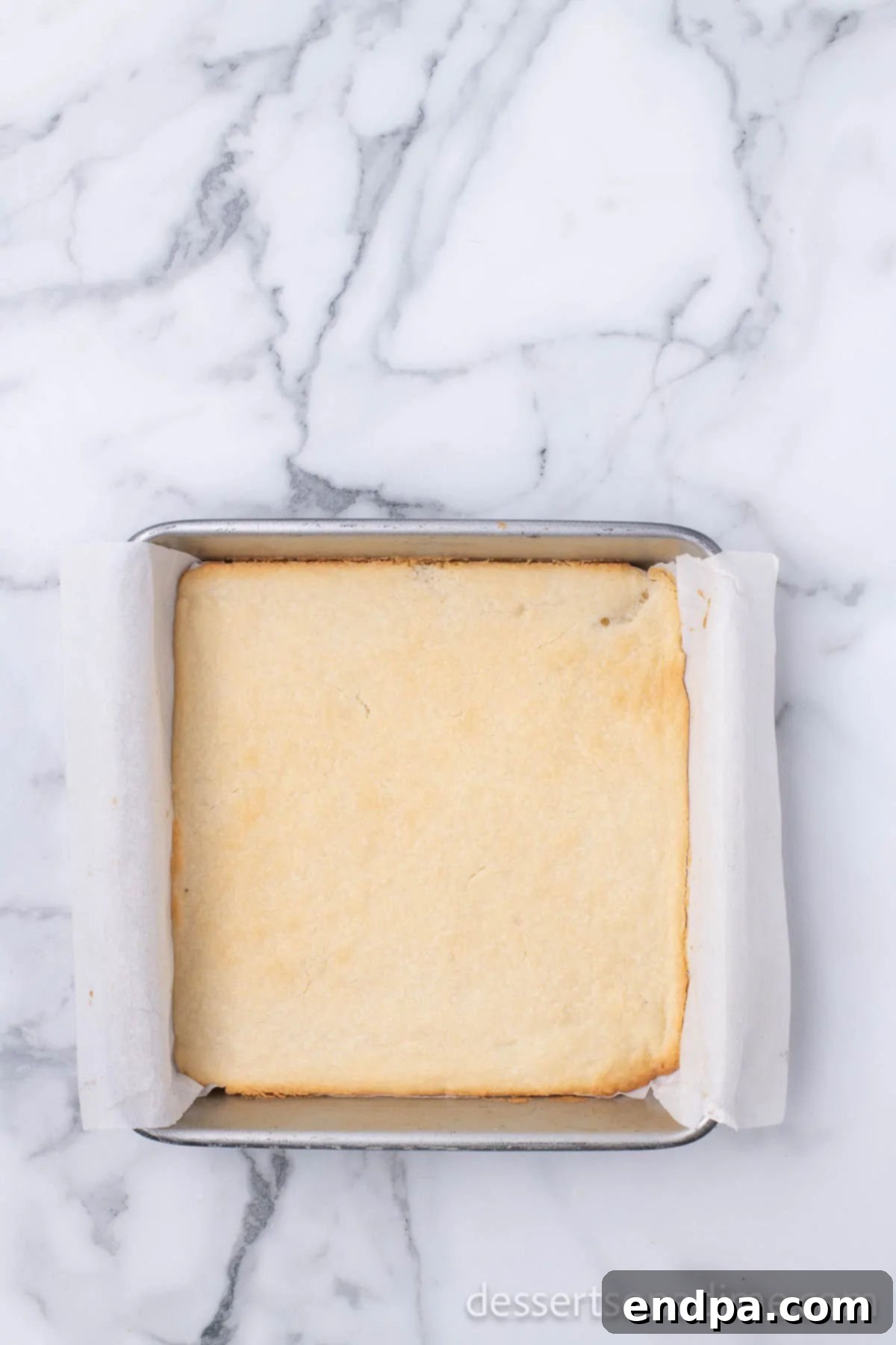 Make Your Own Twix Bars 7 The baked shortbread crust, golden brown and cooled in the pan.