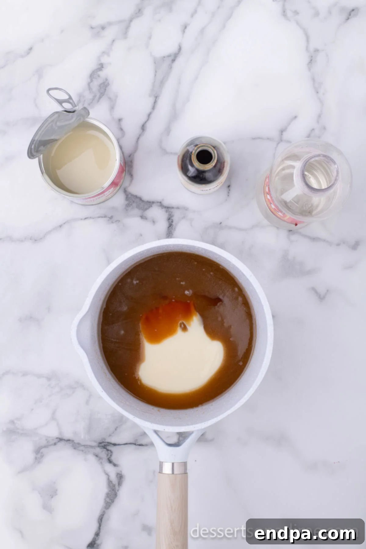 Make Your Own Twix Bars 10 Sweetened condensed milk, corn syrup, and vanilla extract being whisked into the butter and brown sugar mixture.