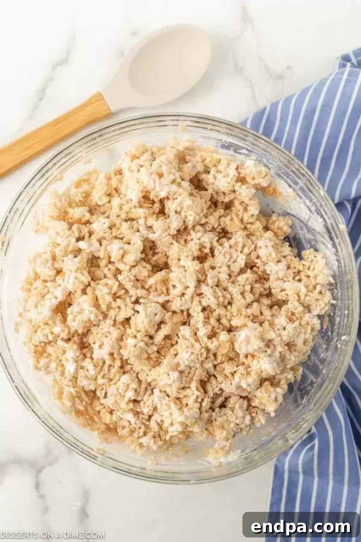 Cloud-Like Marshmallow Fluff Krispie Treats 4 Crispy rice cereal in a large mixing bowl, ready for the marshmallow fluff mixture.