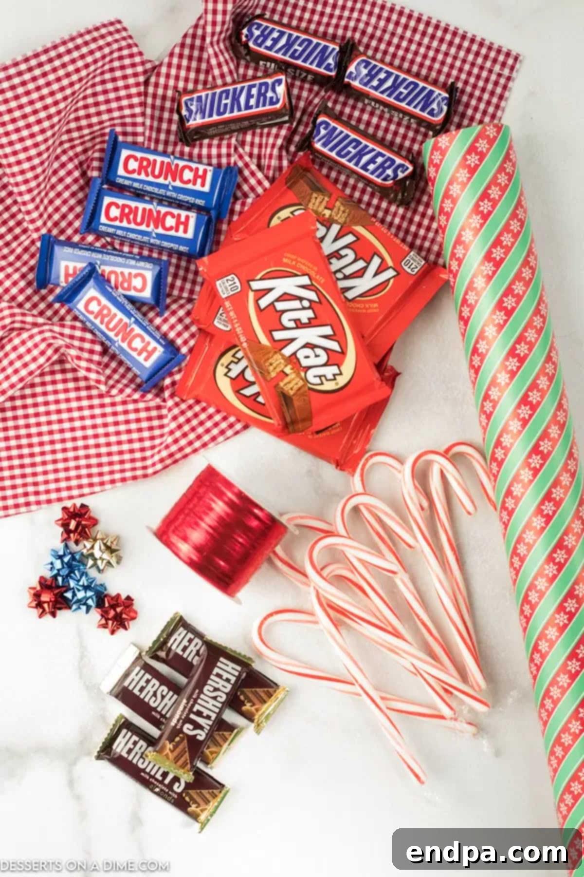 Supplies needed: candy bars, festive wrapping paper, ribbon, candy canes, and tape.