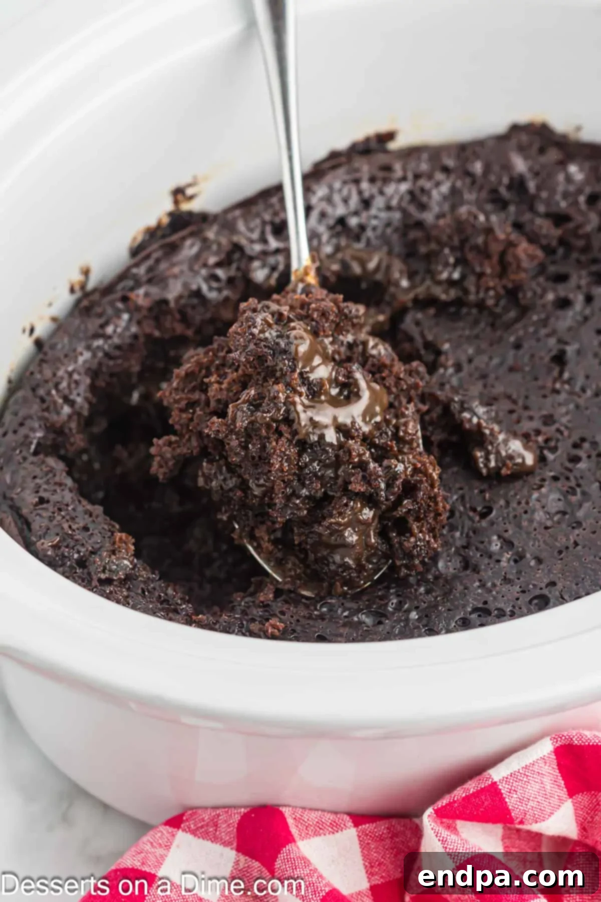 Effortless Slow Cooker Molten Chocolate Cake 2 Crockpot with lava cake inside, ready to be served.
