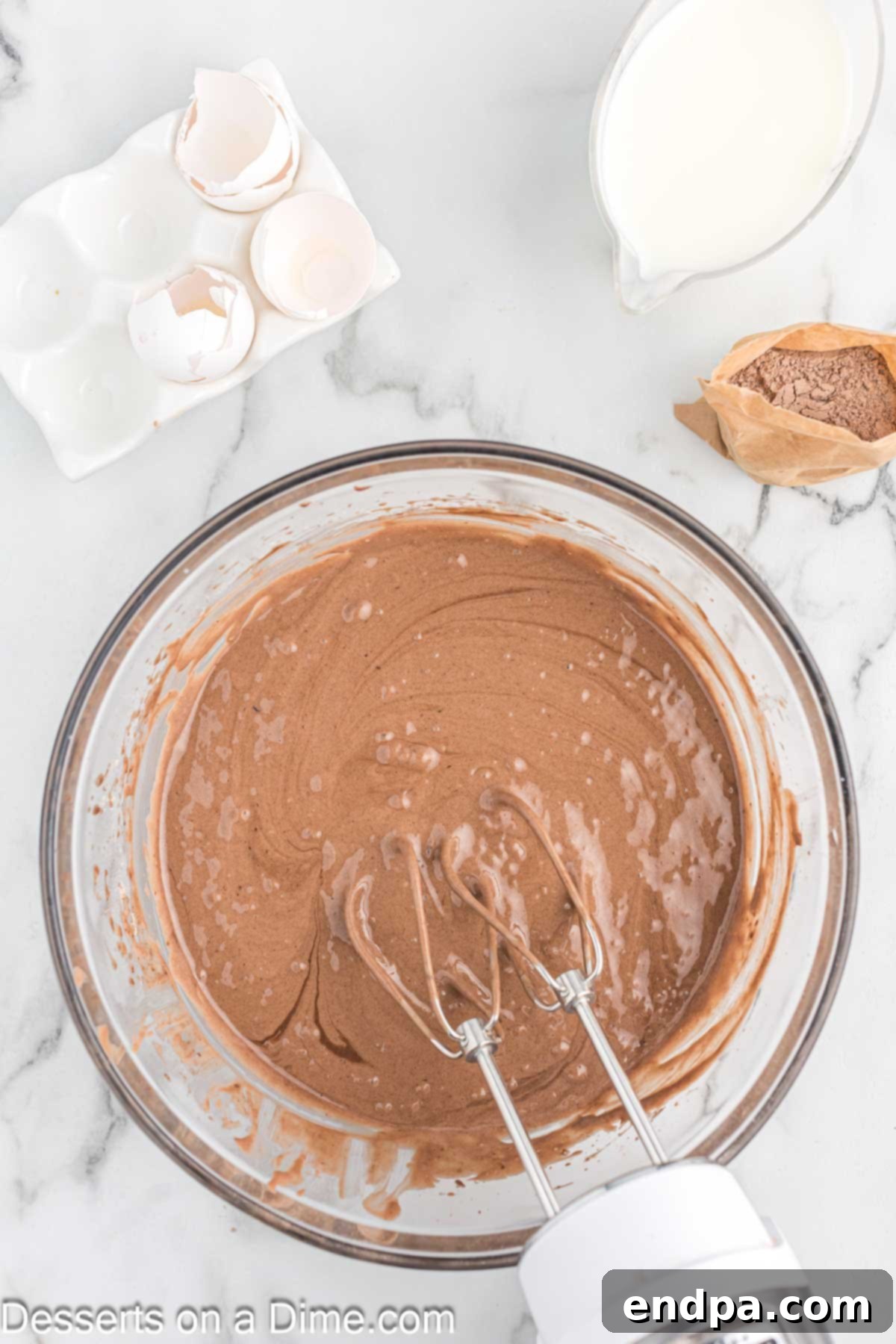 Effortless Slow Cooker Molten Chocolate Cake 4 Mixing bowl with cake mix and other wet ingredients.