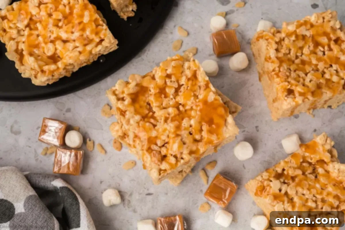 Squares of caramel rice krispie treats ready to enjoy.