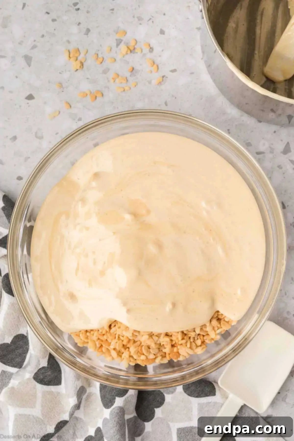 Melted marshmallows in bowl with cereal.