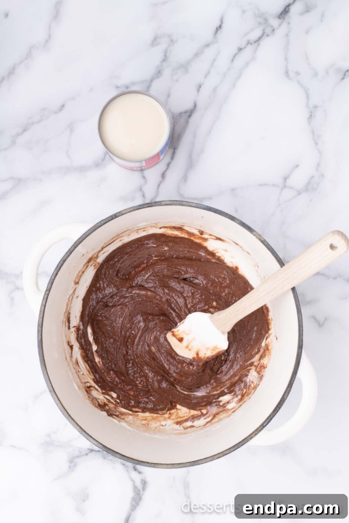 Campfire Delight Cake 6 The melted chocolate, marshmallow, and butter mixture, now perfectly combined and smooth, ready for the next ingredient.