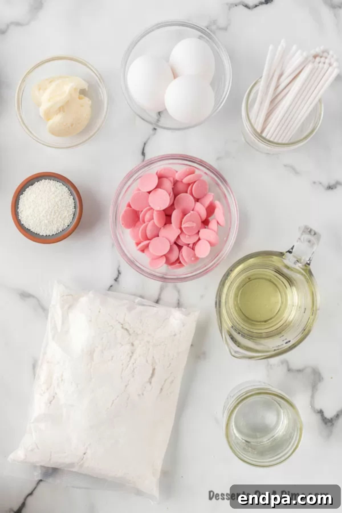 Copycat Starbucks Cake Pops 3 Ingredients for cake pops: Cake mix, oil, eggs, vanilla icing, pink candy melts, and white sprinkles.