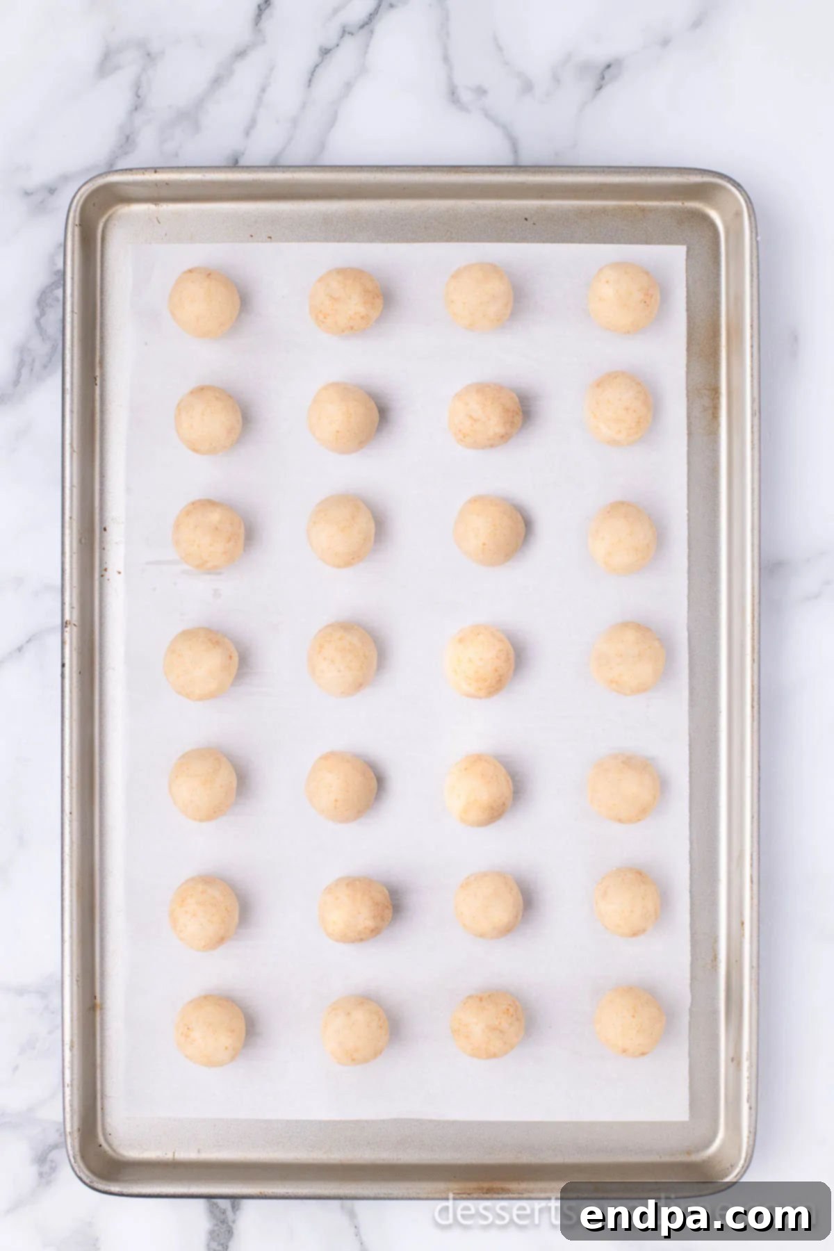 Copycat Starbucks Cake Pops 10 Cake balls on a baking sheet lined with parchment paper.