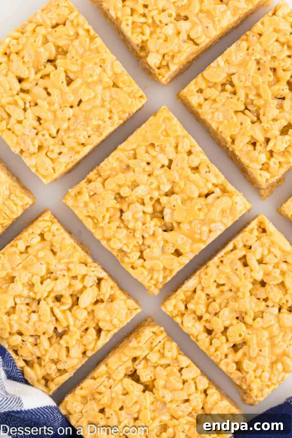 Butterscotch Rice Krispie Treats cut into neat bars, showcasing their golden color and gooey texture.