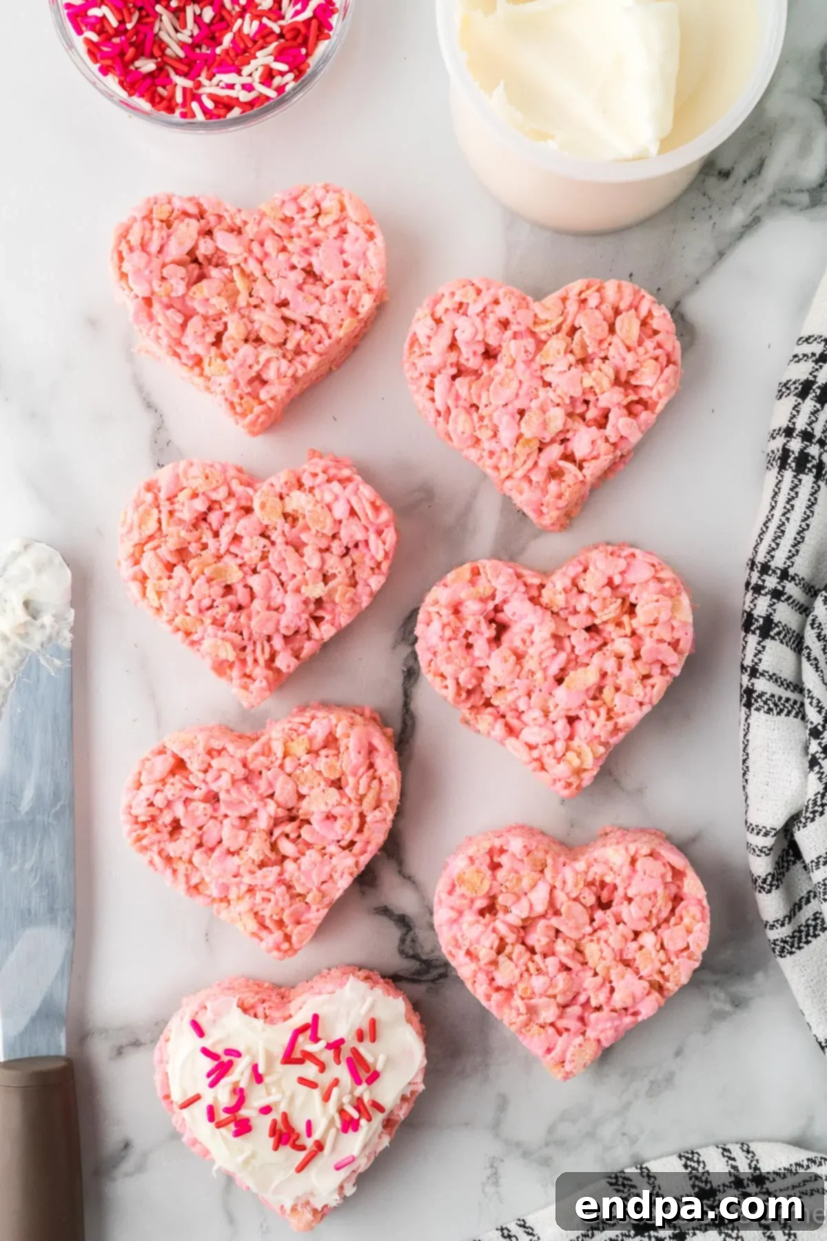 Sweetheart Crispy Treats 8 Heart shaped treats with icing. Finished heart-shaped Rice Krispie treats with a dollop of frosting.