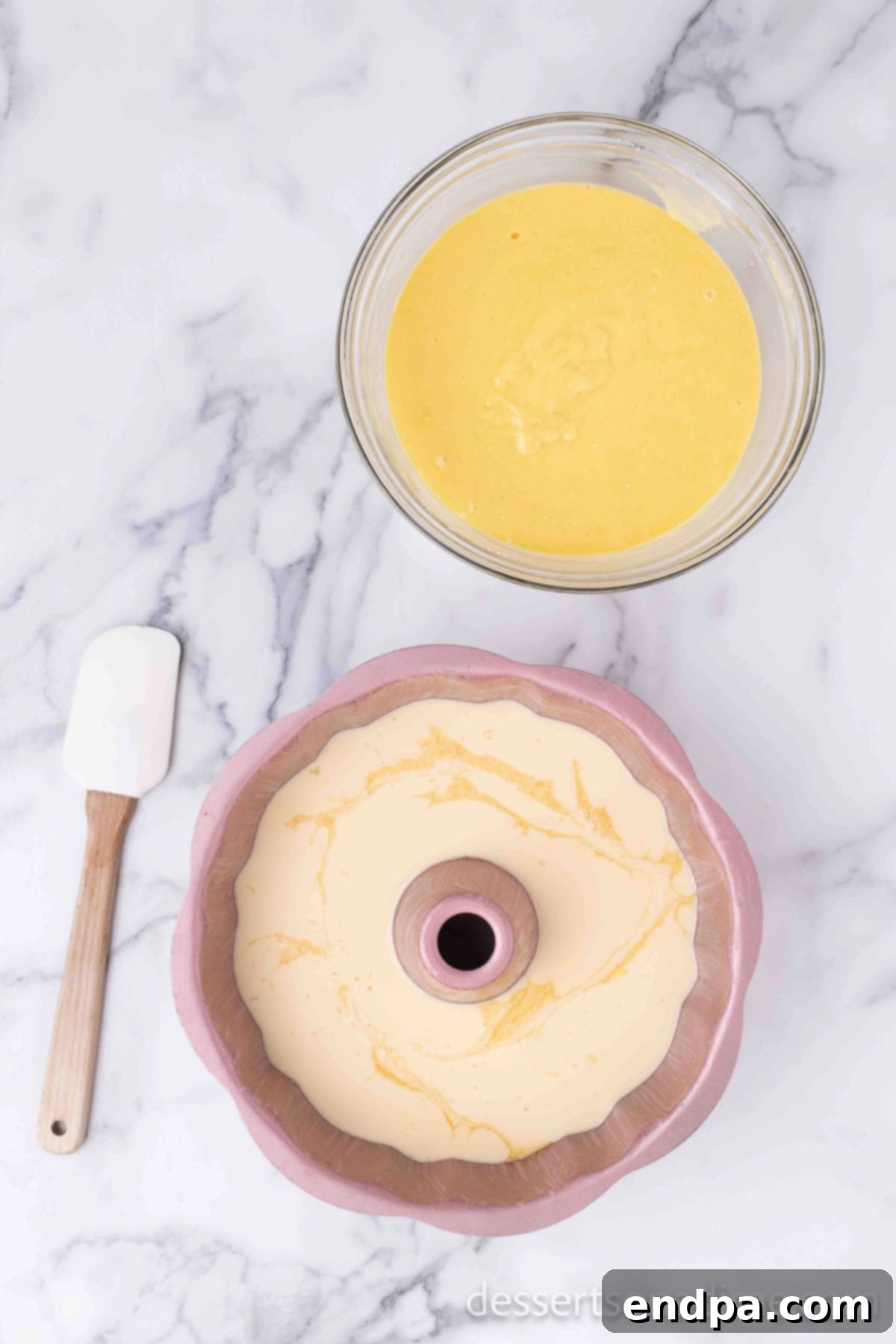Flan mixture being poured into the bundt pan over the caramel layer.