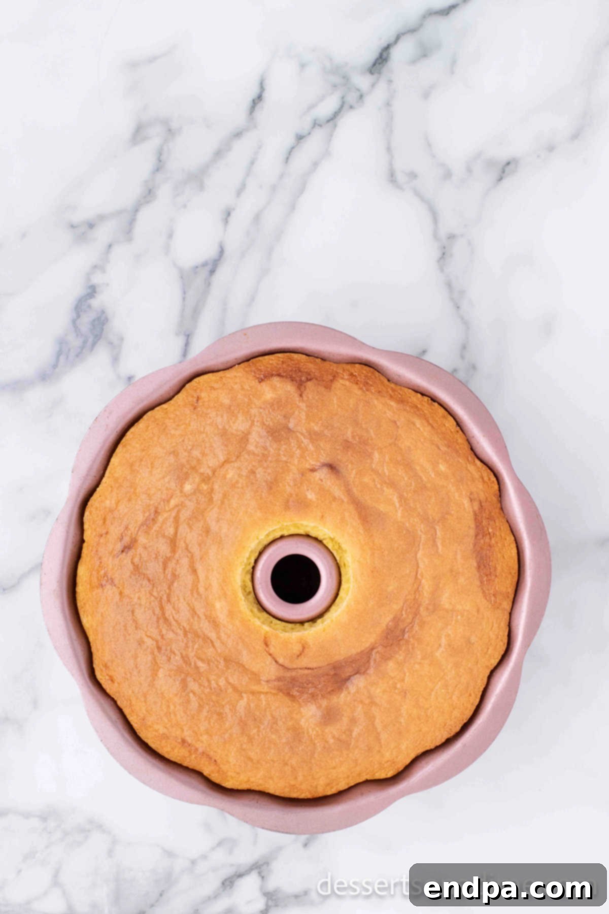 Baked flan cake cooling in the bundt pan.
