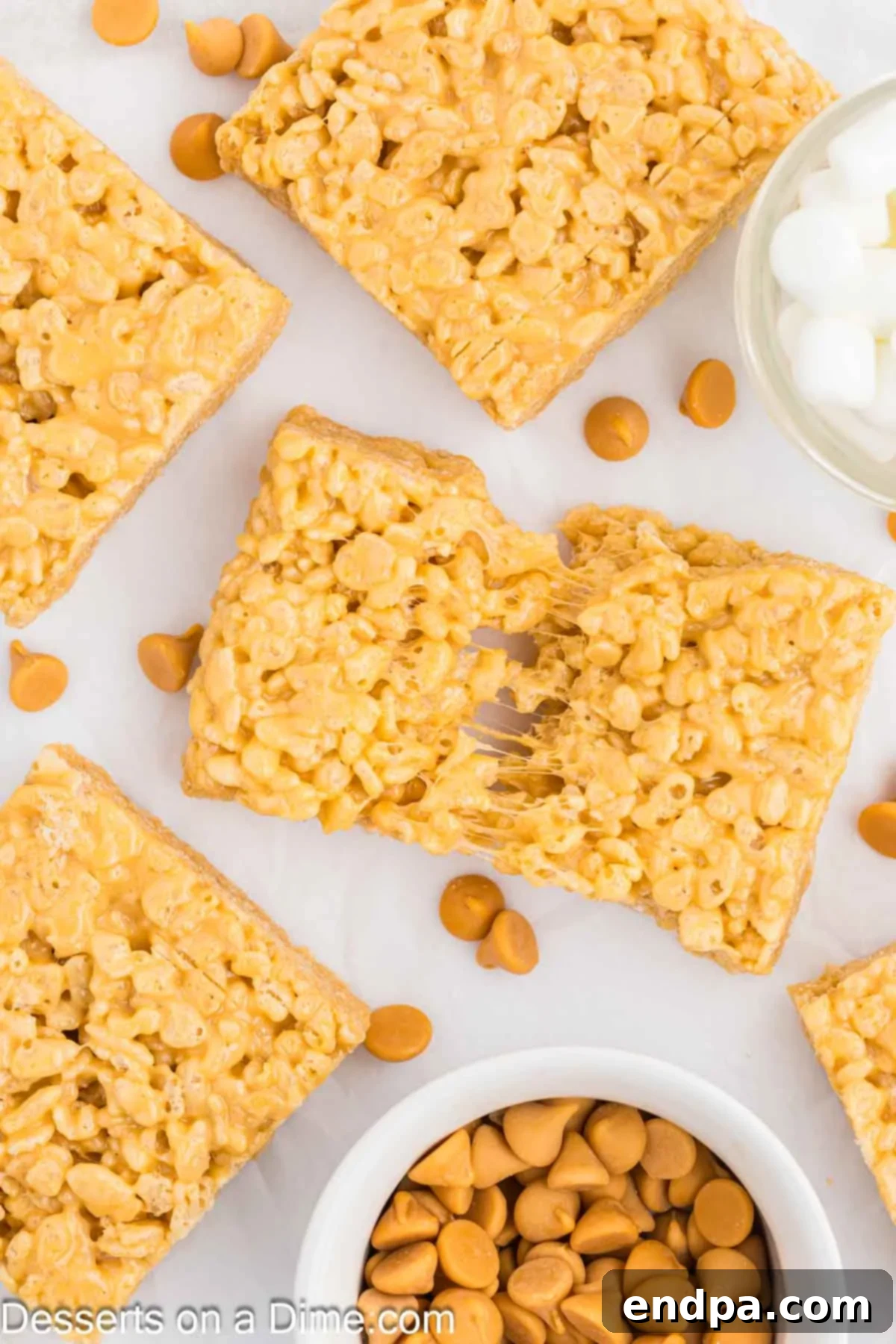 Perfectly cut Brown Butter Rice Krispy Treats stacked on a serving plate.