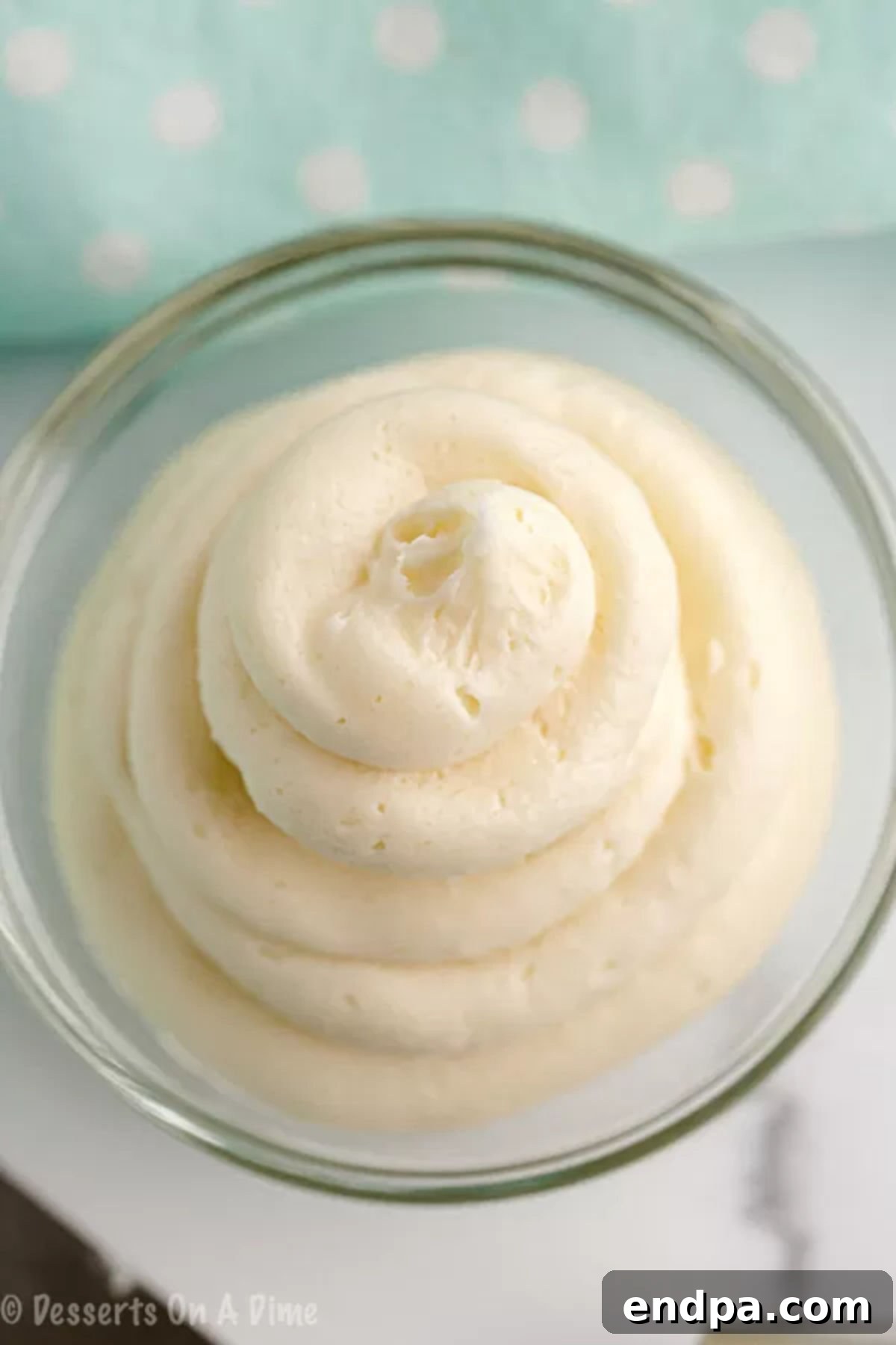 A bowl of creamy, homemade Keto Cream Cheese Frosting ready to be used on your favorite low-carb desserts.