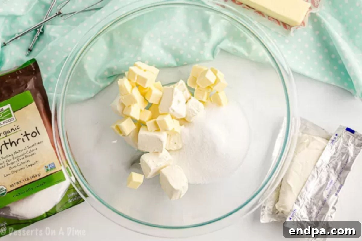 Softened butter and cream cheese in a mixing bowl, ready to be creamed together for the keto frosting.