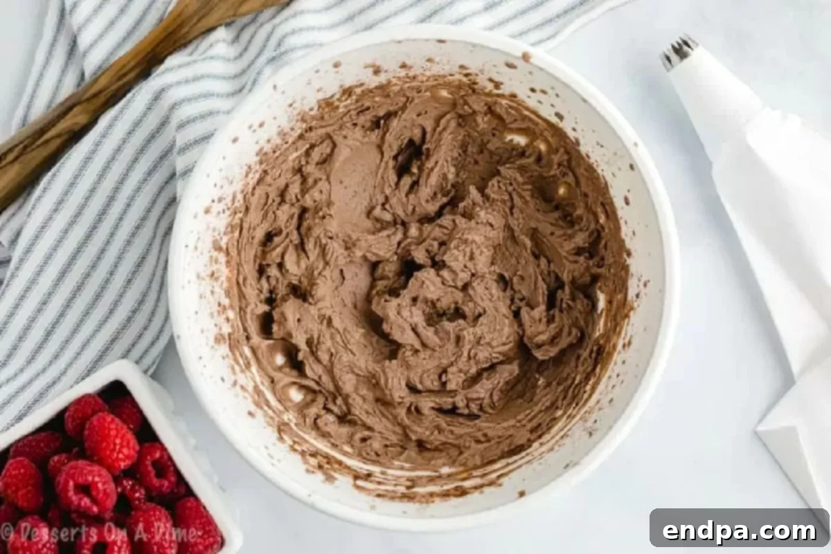 Mousse ingredients combined with an electric mixer.