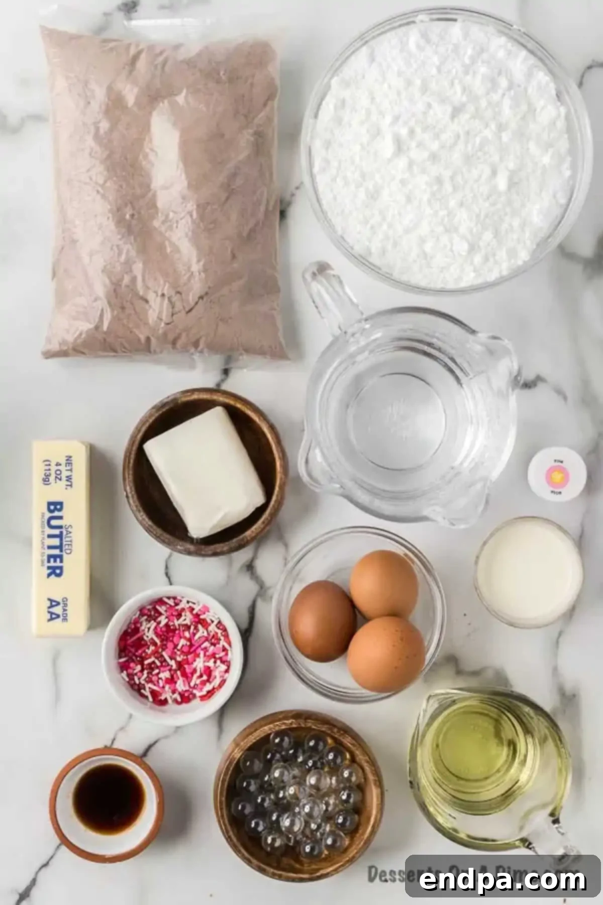 Cupid's Cupcakes 3 Baking ingredients for heart cupcakes, including cake mix, eggs, oil, butter, powdered sugar, and pink food coloring.