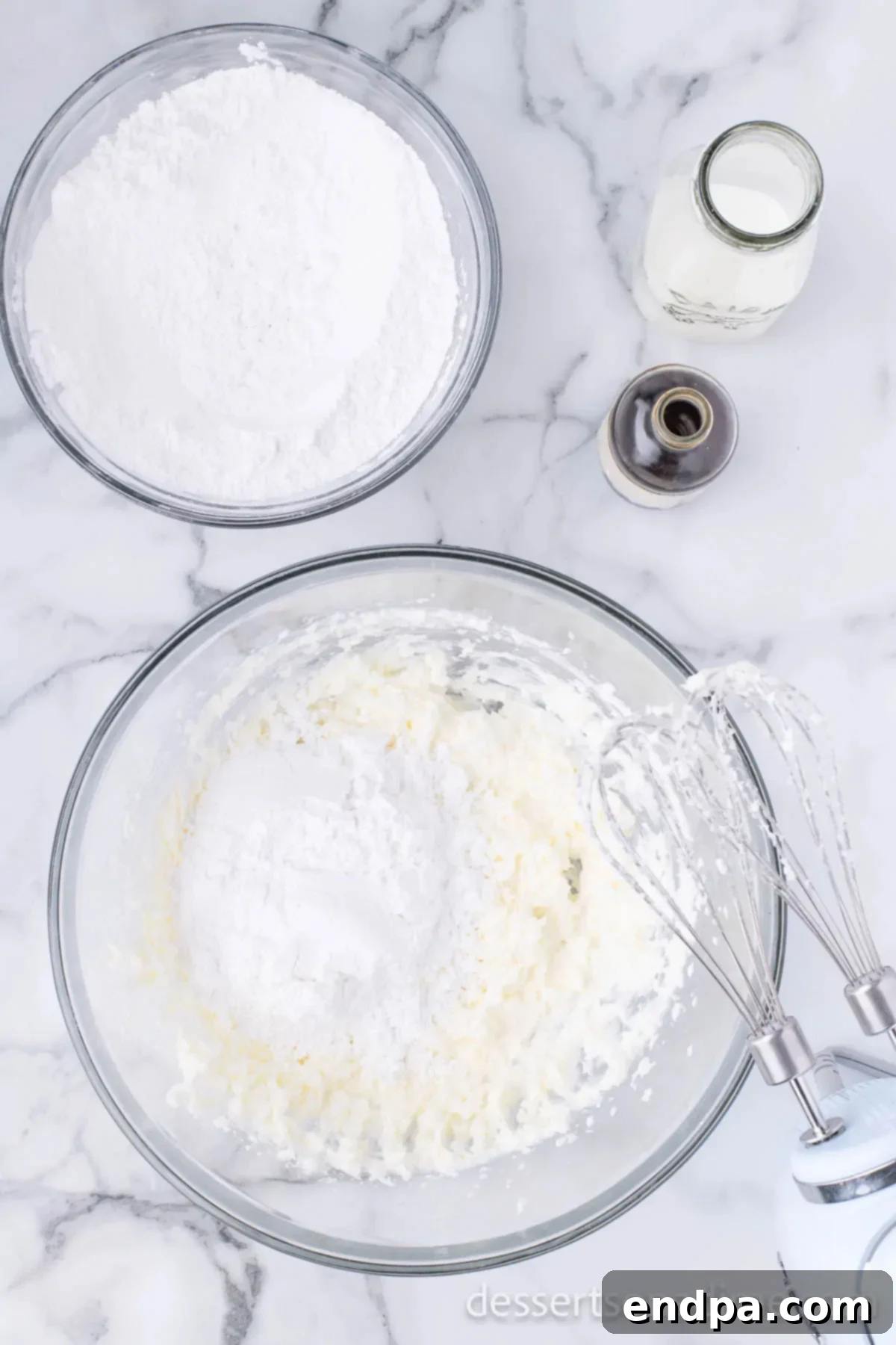 Cupid's Cupcakes 8 Powdered sugar being added gradually to the butter and shortening mixture.