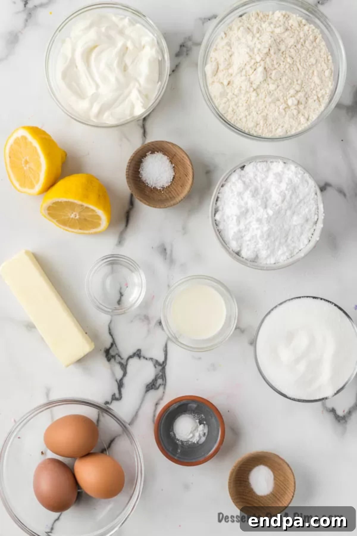 Starbucks Famous Lemon Loaf At Home 3 Ingredients needed for lemon loaf, including flour, salt, baking soda, baking powder, butter, sour cream, sugar, eggs, lemon extract, fresh lemons, powdered sugar, and milk.