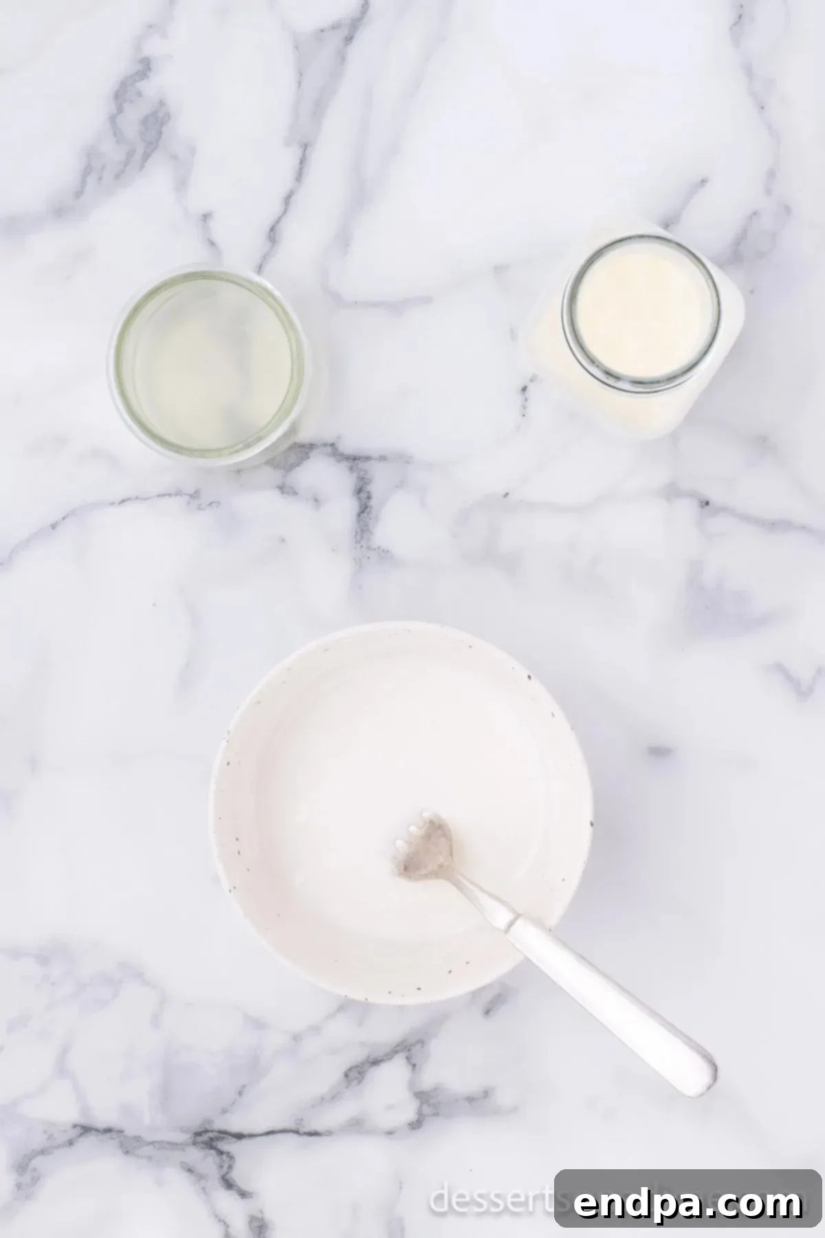 Starbucks Famous Lemon Loaf At Home 8 A bowl containing powdered sugar, milk, and lemon juice, ready to be whisked into a glaze.