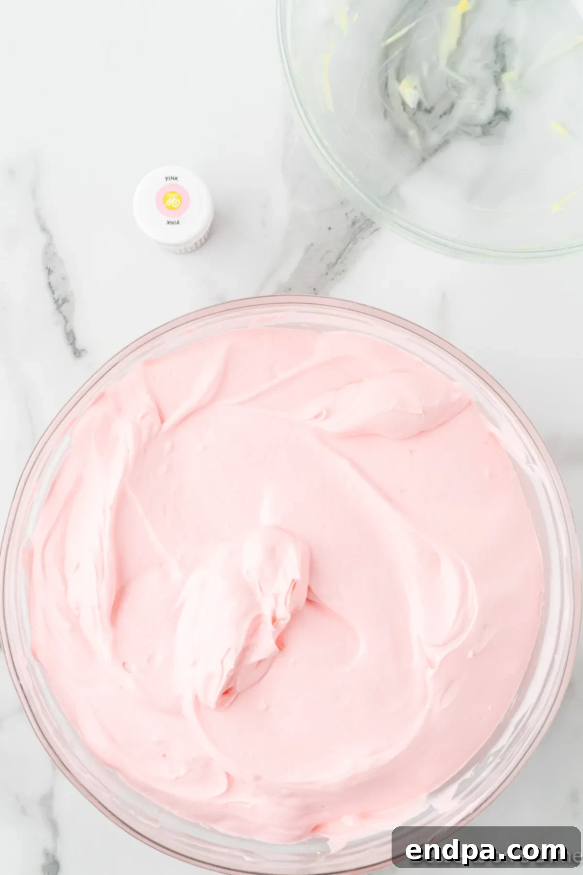 Pink food coloring added to mixture.