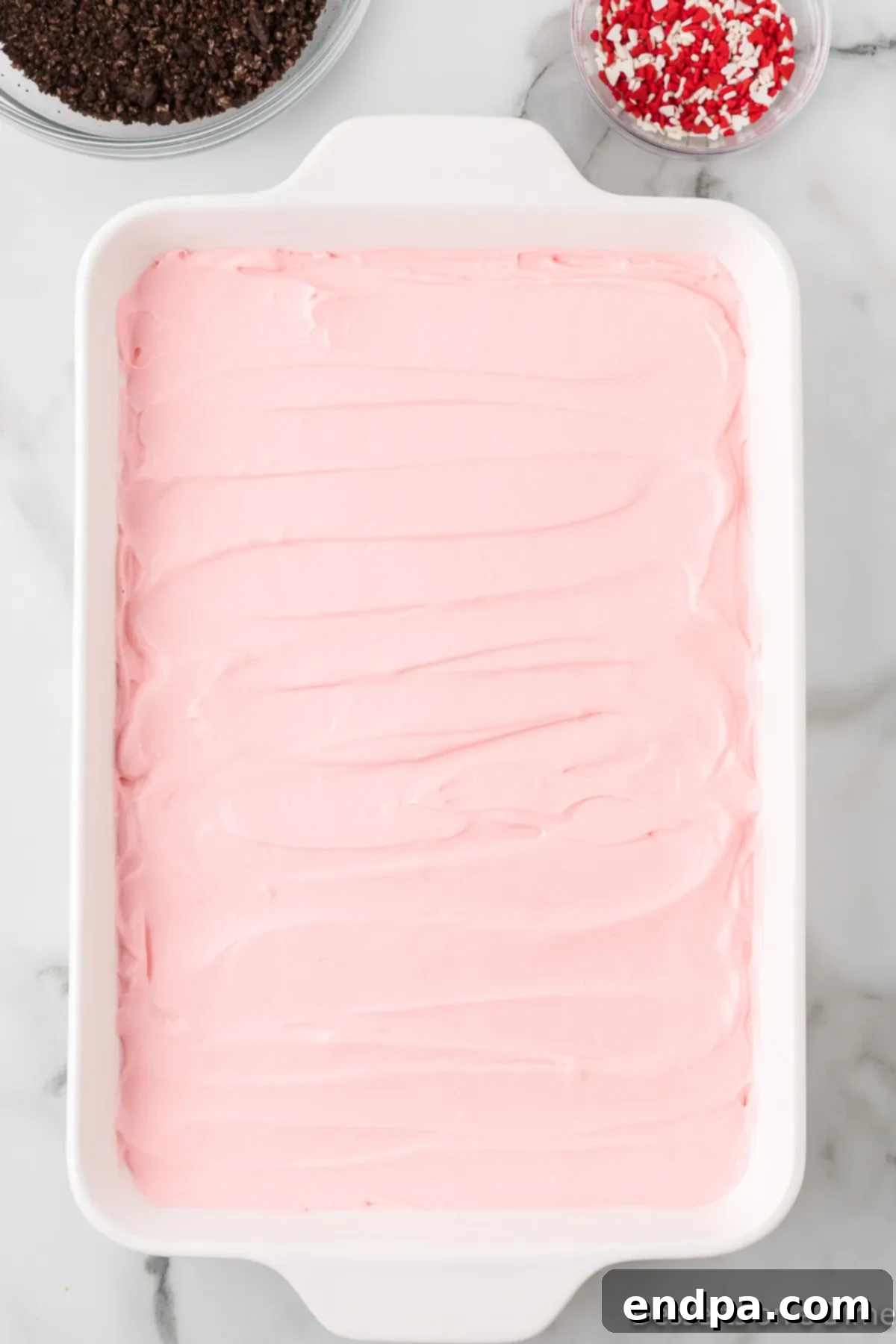 Pudding mixture spread in dish.