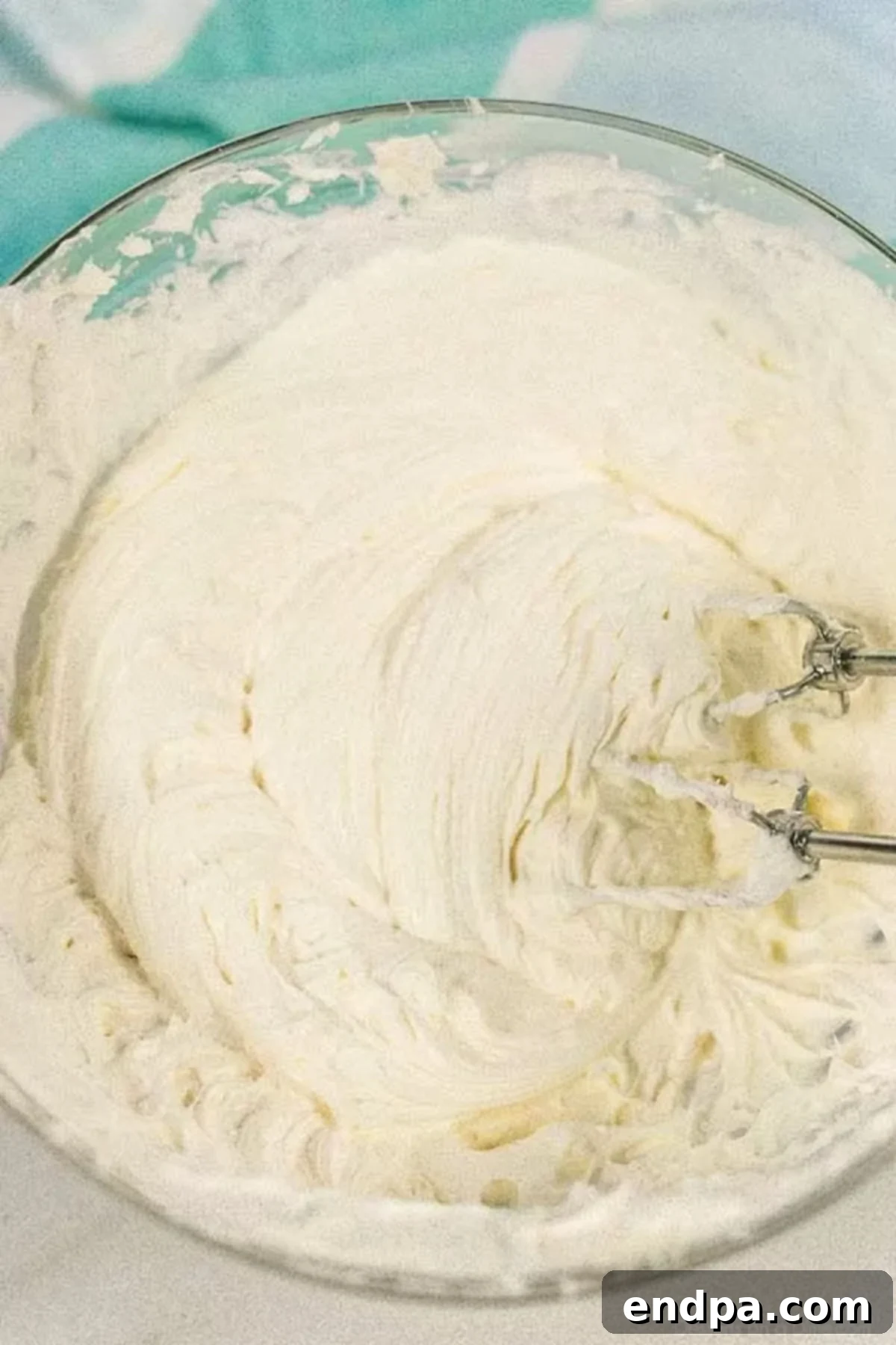 Spring Garden Dirt Cake 5 Thickened pudding mixture gently folded into the cream cheese and whipped topping blend.