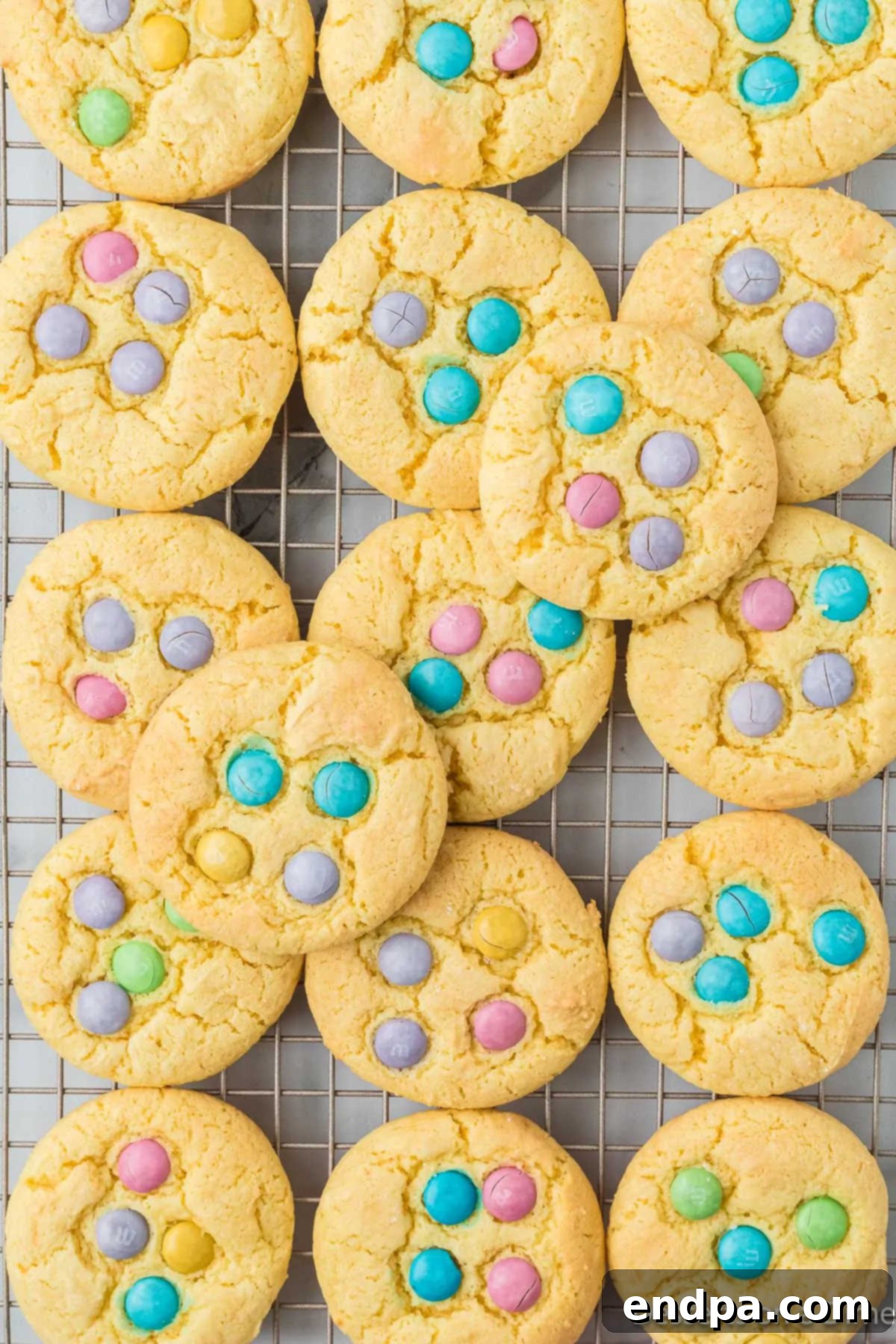 Delicious and colorful Easter Cake Mix Cookies cooling on a wire rack.