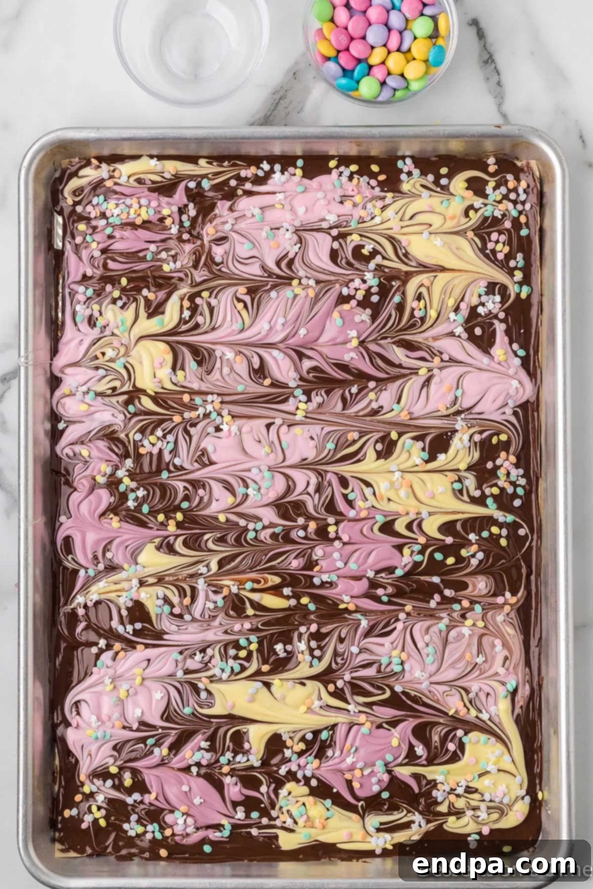 The chocolate bark sprinkled with pastel M&Ms and various sprinkles.