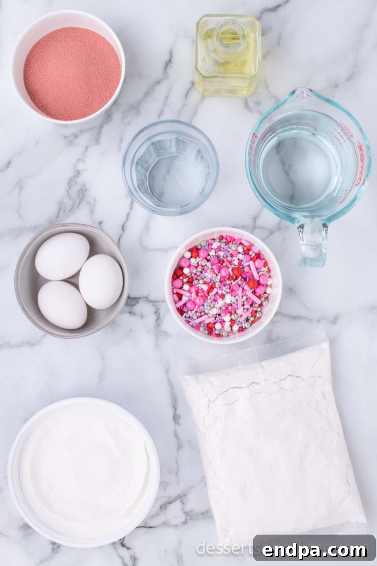 Romantic Valentines Poke Cake 3 Ingredients for Valentine's Day Poke Cake including white cake mix, strawberry jello, whipped topping, and sprinkles.