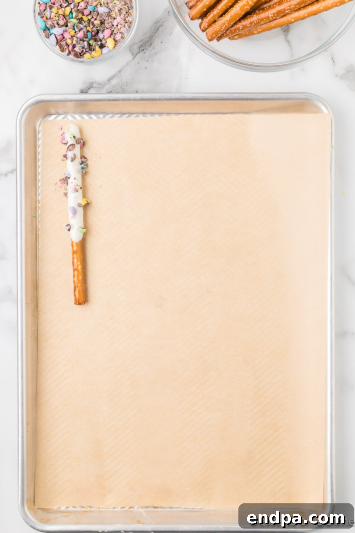 Pretzel on lined baking sheet. 