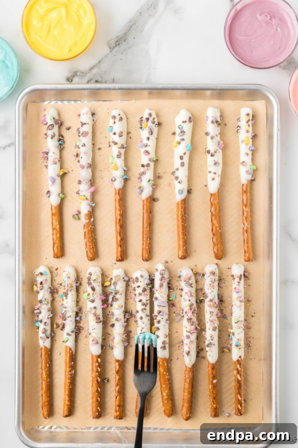 Pretzels ready for candy melts on top. 